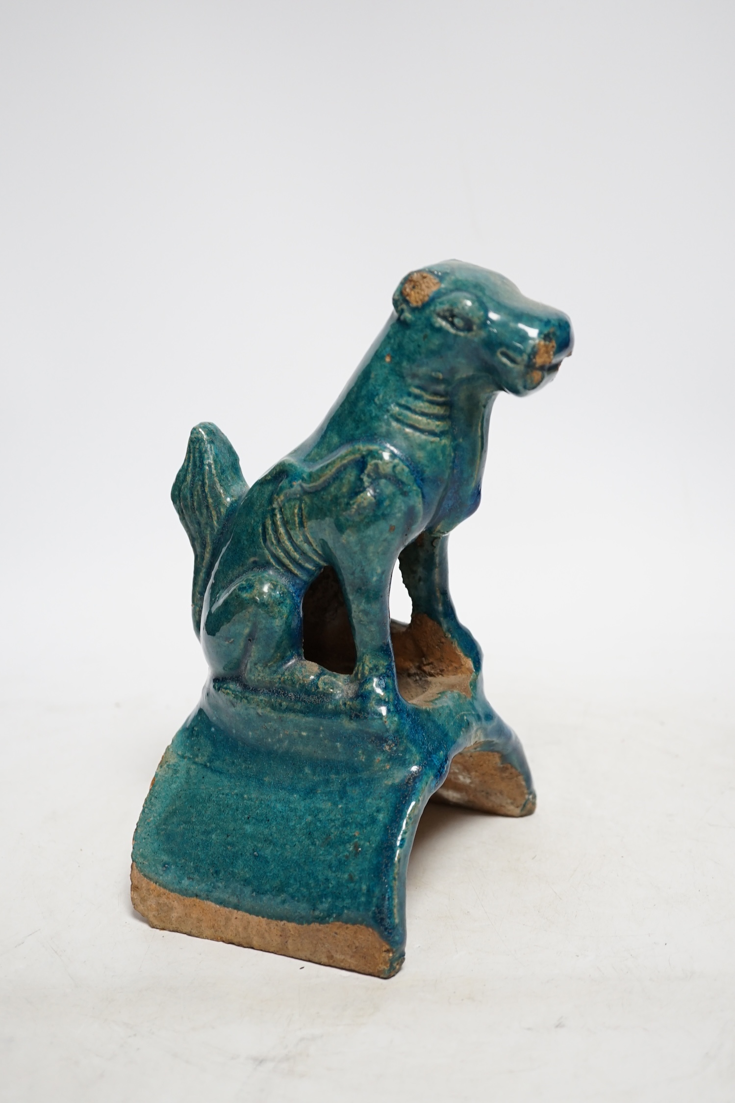 A Chinese turquoise glazed lion-dog ridge tile, Ming dynasty, 22cm high